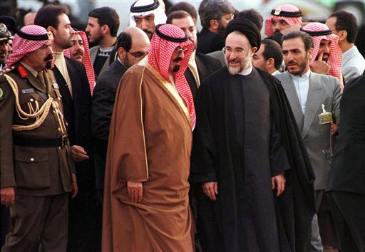 Saudi Arabia Crown Prince Abdullah Bin Abdul Aziz Al-Saud center left is greeted at Mehrabad Airport in Tehran by Iranian President Mohammad Khatami center right ahead of the Islamic Conference in the Iranian capital