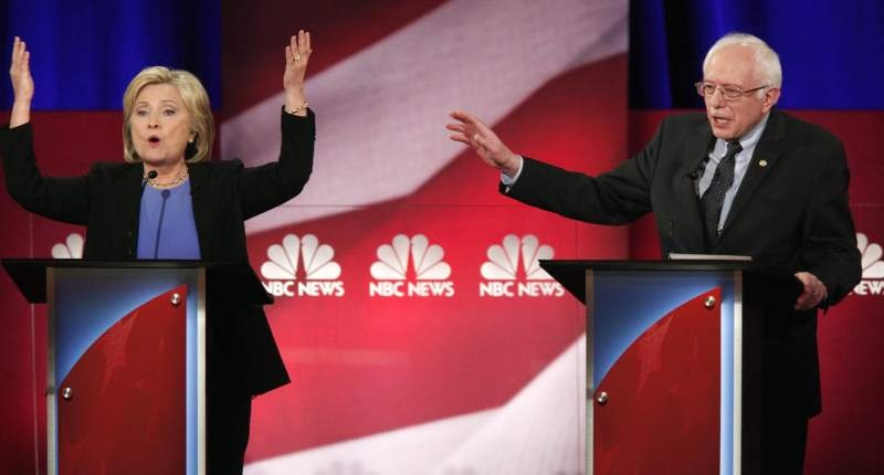 Hillary Clinton and rival candidate Bernie Sanders speak simultaneously on Jan. 17 2016