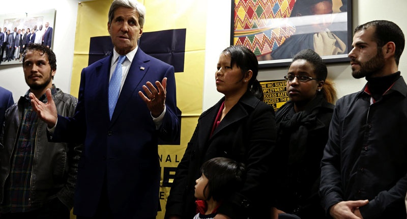 U.S. Secretary of State John Secretary Kerry meets with a group of refugees and staff members at a refugee resettlement center in Silver Spring Maryland