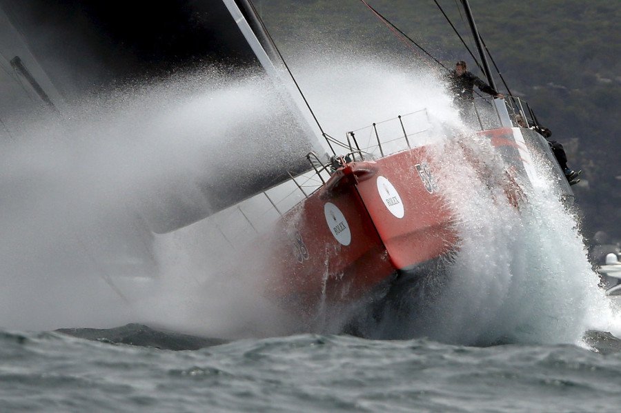 Maxi yacht Comanche powers through heavy swells outside Sydney’s harbor during the 71st Sydney to Hobart Yacht race Australia’s premiere bluewater classic race on Dec.26 2015