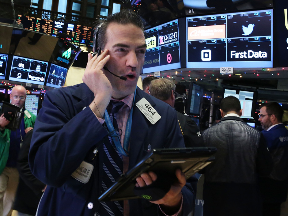 Traders work on the floor of the New York Stock Exchange