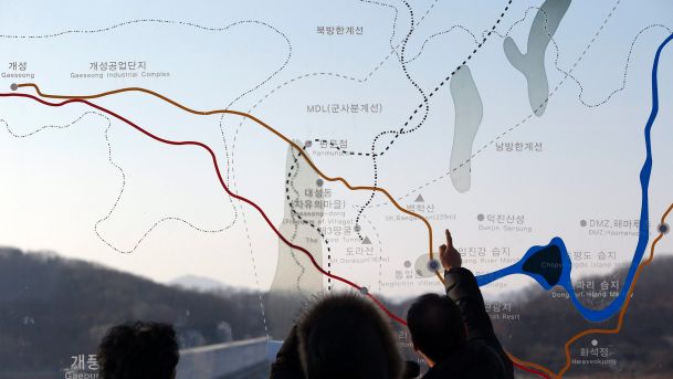 People look at a map of the border area between North and South Koreas at the Imjingak Pavilion near the border village of Panmunjom which has separated the two Koreas since the Korean War South Korea