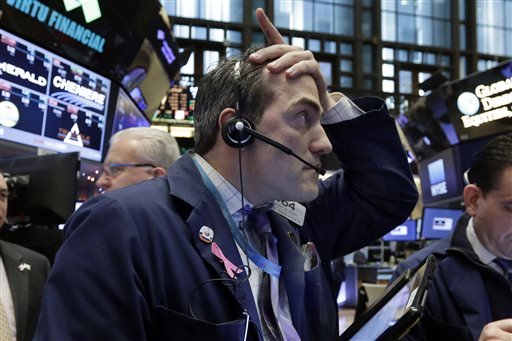 Trader Gregory Rowe works on the floor of the New York Stock Exchange Wednesday Jan. 6 2016. Stocks are opening lower as investors fret about signs of belligerence in North Korea and more weakening of China's economy