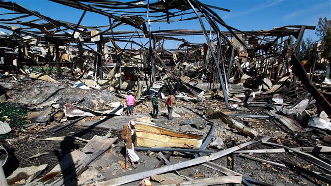 Yemeni workers inspect damage at a beverage producing factory in the capital Sana’a after it was destroyed by Saudi airstrikes on Dec. 30 2015