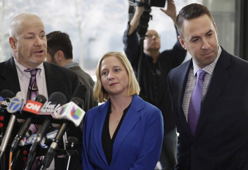 Mark Smolens left Nicole Barkowski and Brian Coffman right attorneys for the family of Cedrick Chatman who was shot and killed by Chicago police in 2013 speak at a news conference at the federal courthouse Thursday Jan. 14 2016 in Chicago