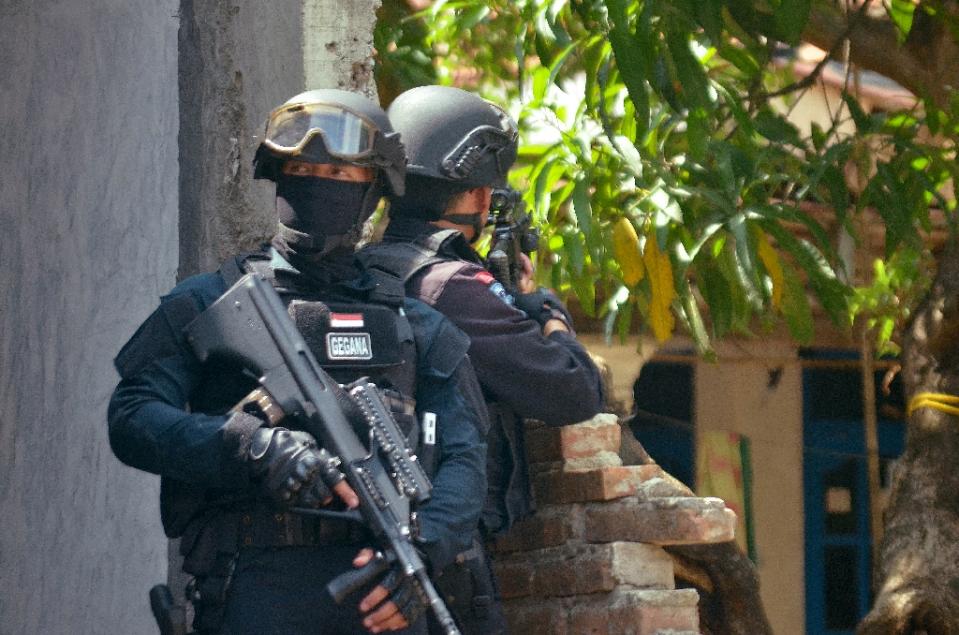 Elite Indonesian police commandos raid the home of a suspected terrorist in Cirebon on western Java island