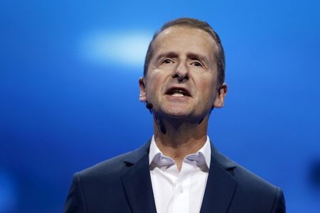 Herbert Diess chairman of the board of Volkswagen Brand unveils the BUDD-e electric and connected car during a keynote address at CES International Tuesday Jan. 5 2016 in Las Vegas