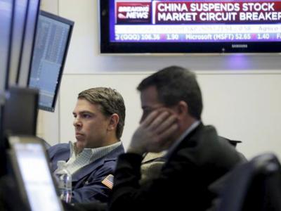 Traders work on the main trading floor of the New York Stock Exchange shortly after the opening bell of the trading session in the Manhattan borough of New York City 7 January 2016. – Reuters