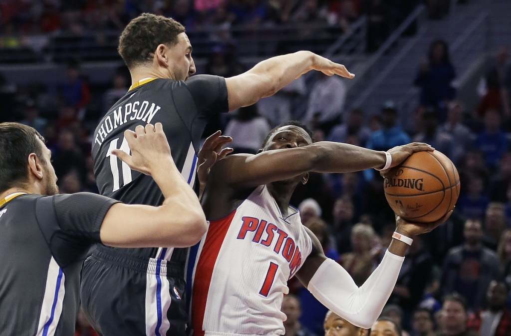 Golden State Warriors guard Klay Thompson towers over Detroit Pistons guard Reggie Jackson during the first half Saturday Jan. 16 2016 in Auburn Hills Mich