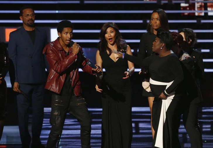 An unidentified man interrupts the acceptance speech by the cast of'The Talk' who won the award for favorite daytimeTV hosting team at the People's Choice Awards 2016 in Los Angeles California