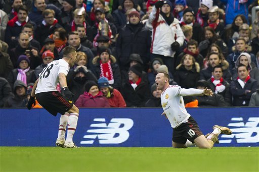 Manchester United's Wayne Rooney right celebrates after scoring during the English Premier League soccer match between Liverpool and Manchester United at Anfield Stadium Liverpool England Sunday Jan. 17 2016