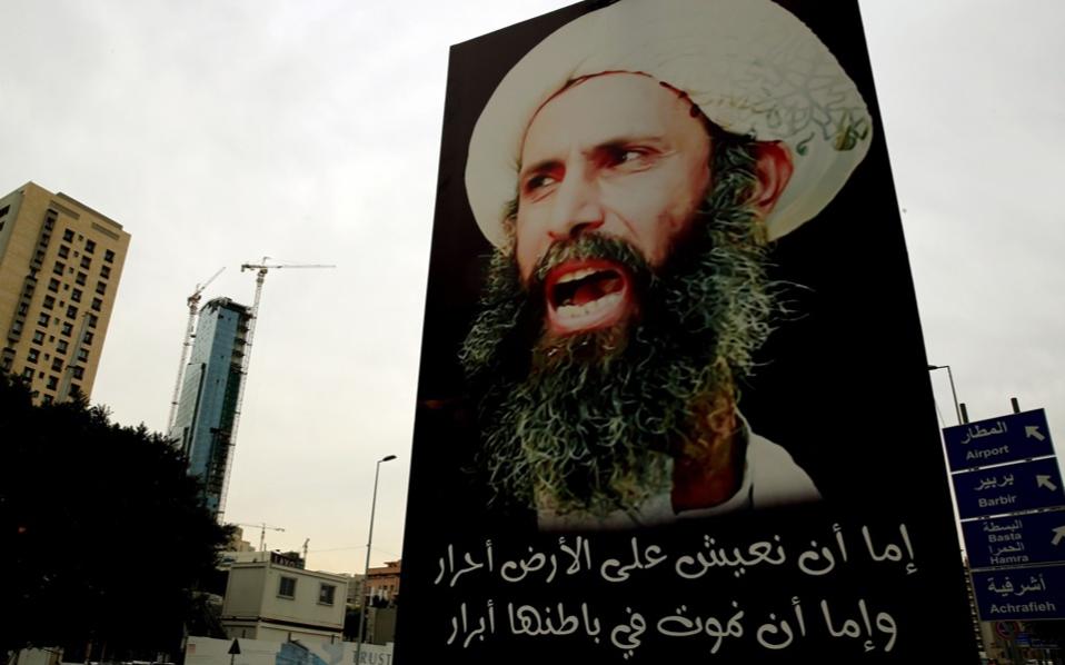 A portrait of late prominent Shiite Muslim cleric Nimr al Nimr is seen hanging on an electricity pole in the Lebanese capital Beirut Thursday