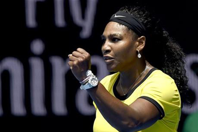 Serena Williams of the United States celebrates after winning a point against Maria Sharapova of Russia during their quarterfinal match at the Australian Open tennis championships in Melbourne Australia Tuesday Jan. 26 2016