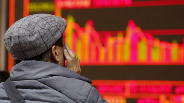 The official Xinhua news agency said Thursday that trading on the Shanghai and Shenzhen stock exchanges was frozen for the day after shares tumbled more than 7 per cent