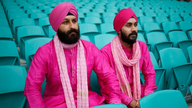 Spectators wait for play on day three of the test match at a sodden Sydney Cricket Ground