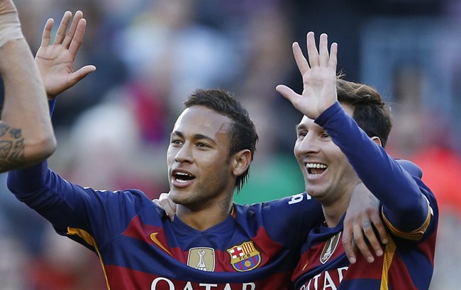 FC Barcelona's Lionel Messi right reacts after scoring against Granada with his teammate Neymar during a Spanish La Liga soccer match at the Camp Nou stadium in Barcelona Spain Saturday Jan. 9 2016