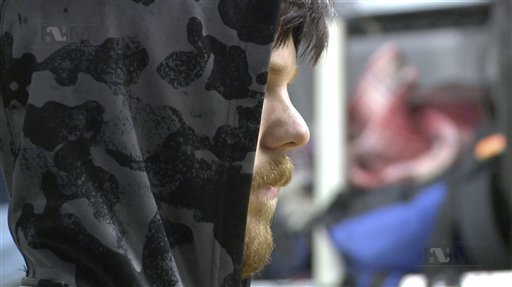 This frame grab from a Thursday Jan. 28 2016 taken from a video provided by Mexico's Instituto Nacional de Migracion INM shows a hooded Ethan Couch as he is processed by Mexican immigration agents in Mexico City. INM said that Couch who used