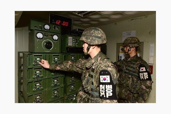 South Korean soldiers stand in front of equipment used for propaganda broadcasts near the border area between South Korea and North Korea in Yeoncheon South Korea Friday Jan. 8 2016. South Korea responded to North Korea's nuclear test with broadcasts