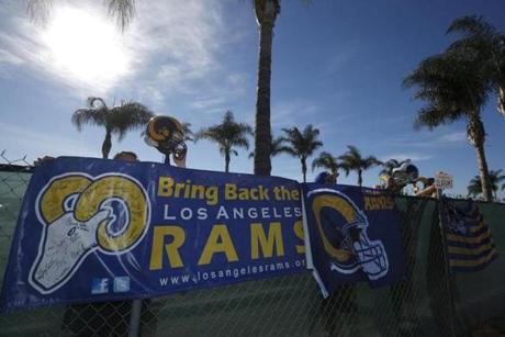 NFL fans Tom Bateman Skye Sverdlin Daniel Balma and Joe Ramirez show their support for the St. Louis Rams NFL team to come to Los Angeles at a news conference to unveil plans for development at the site of the former Hollywood Park Race Track in In