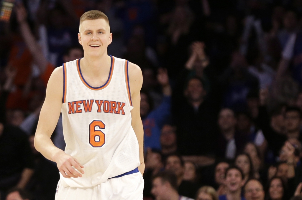 New York Knicks&#039 Kristaps Porzingis smiles after sinking a long three-point basket during the second half of the NBA basketball game against the Milwaukee Bucks Sunday Jan. 10 2016 in New York. The Knicks defeated the Bucks 100-88. (AP