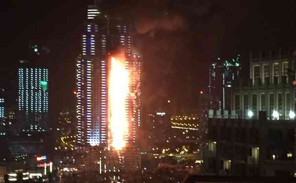 The Emirates News Agency says a massive blaze at a luxury hotel in Dubai has caused 16 minor injuries