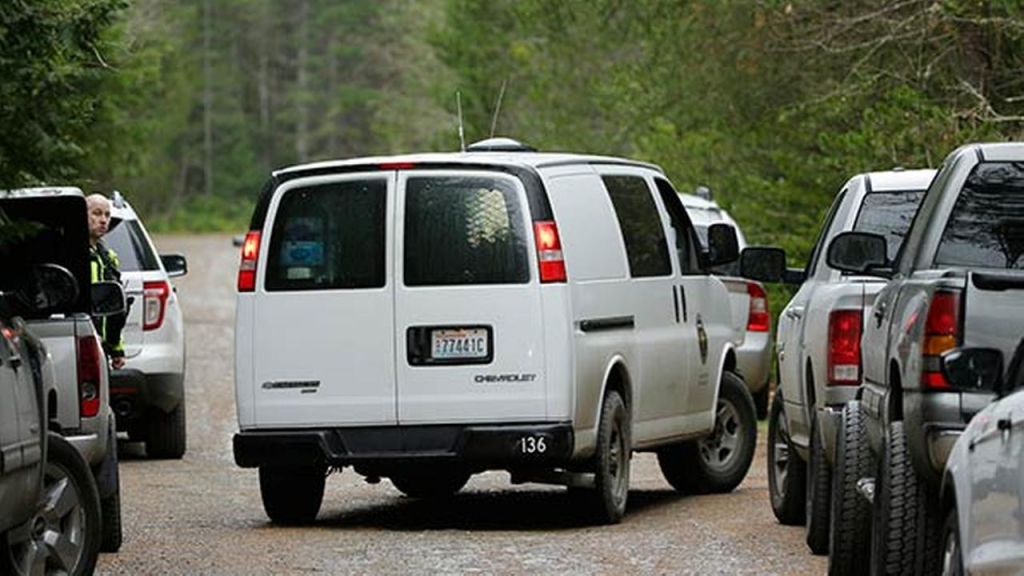 A Mason County Coroners van arrives at the scene of a fatal shooting Friday Feb. 26 2016 near Belfair Wash