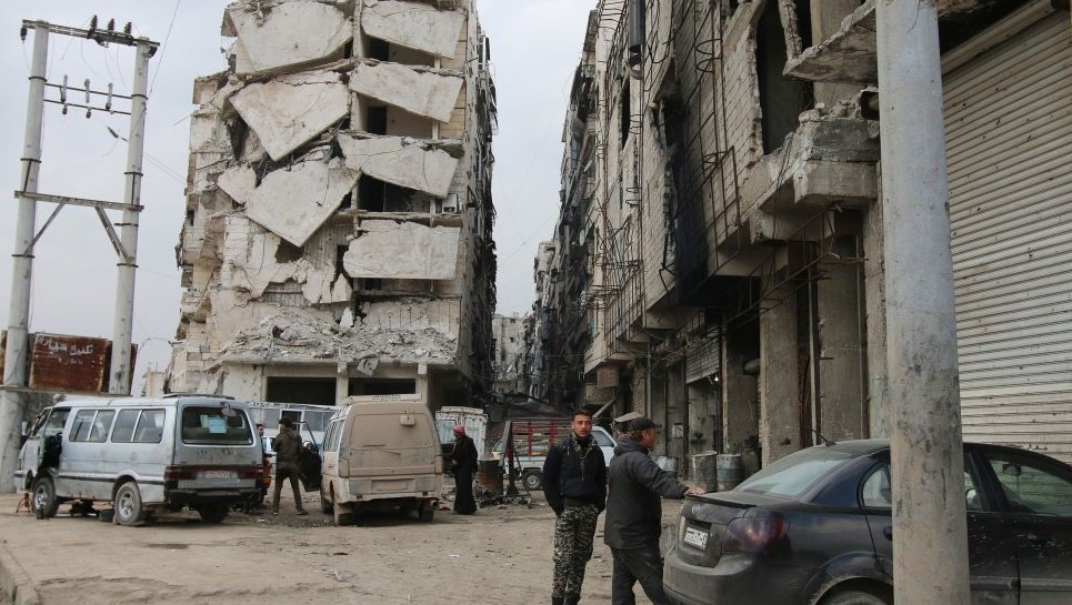 A building is seen with heavy damage in Aleppo Syria