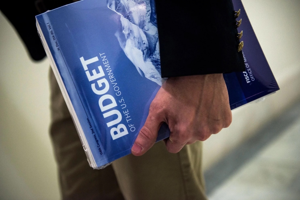 A congressional House staffer holds President Obama’s fiscal 2017 budget in the House Budget Committee Room Feb. 9 on Capitol Hill