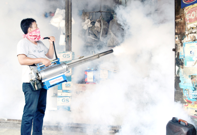 A man fumigates against the Aedes Aegypti mosquitos as a vector of the dengue and Zika viruses in Jakarta on Saturday. — AFP