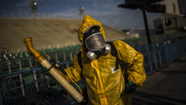 A worker fumigates the Sambadrome before Carnival celebrations in Rio de Janiero