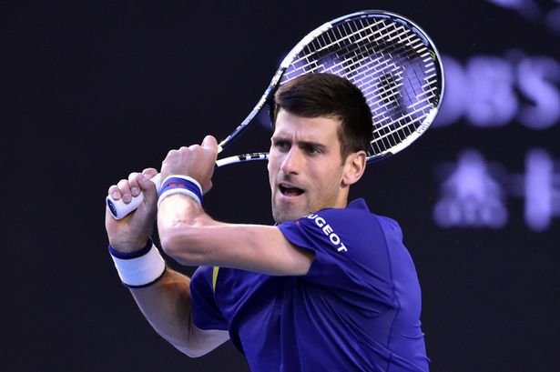 Novak Djokovic hits a return