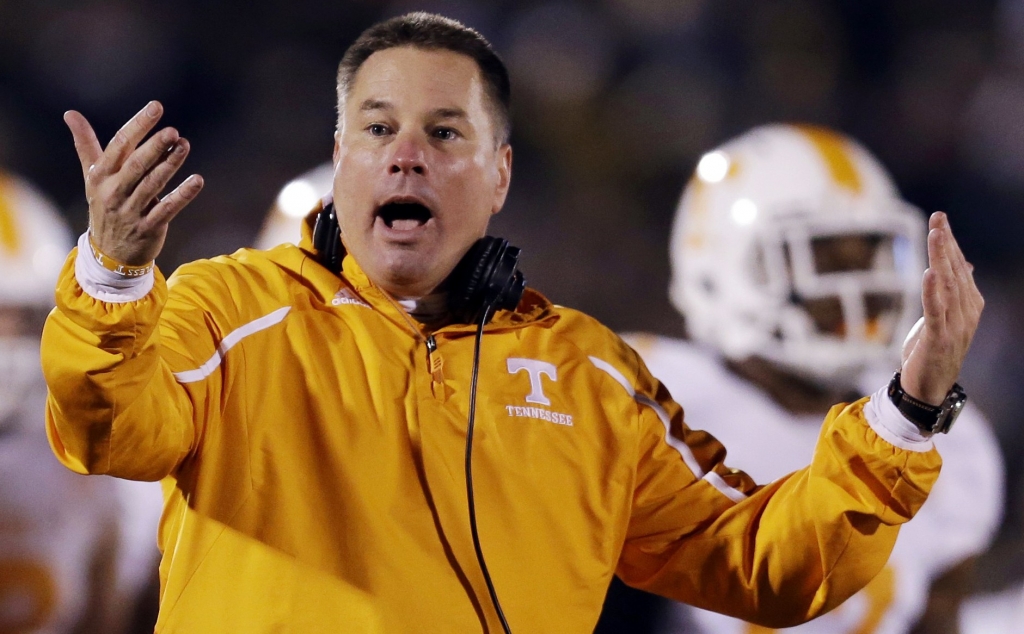 Tennessee head coach Butch Jones yells on the sidelines during the first half of an NCAA college football game against Missouri in Columbia Mo. Jones discusses the opening of a spring practice that features a four