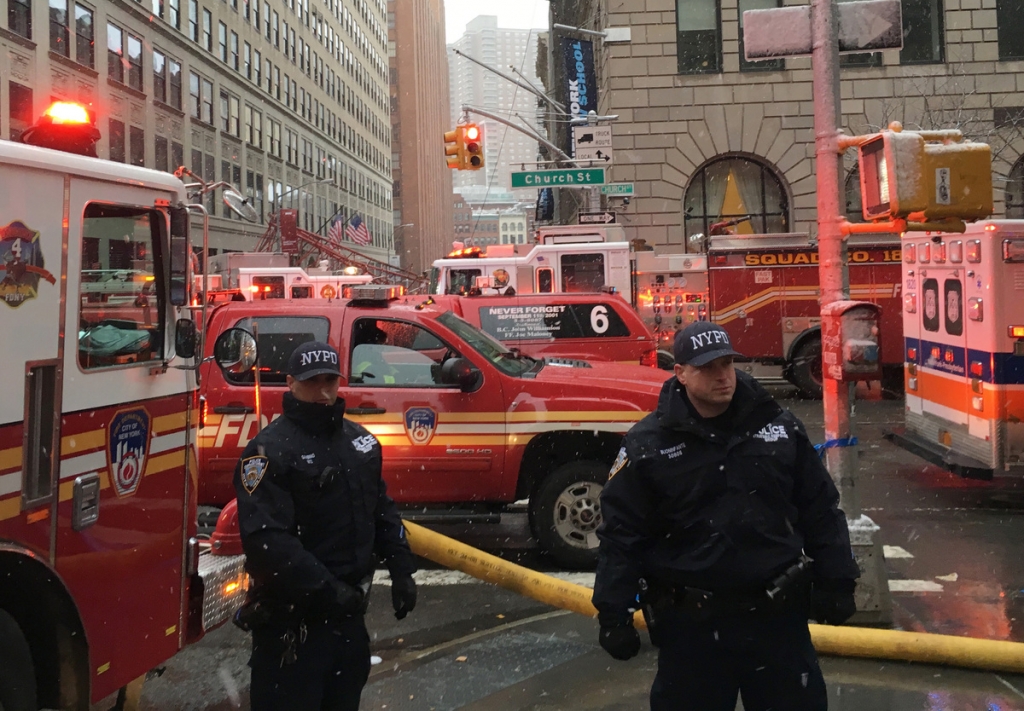 ASSOCIATED PRESS			Emergency workers gather at the scene of a crane collapse in the Tribeca section of Manhattan in New York on Friday Feb.5 2016