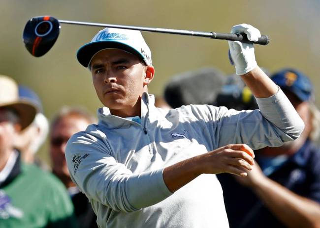 Rickie Fowler following through Thursday on No. 3 during the first round of the Phoenix Open