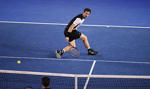 Britain's Andy Murray plays a backhand return during his men's singles semi-final match against Canada's Milos Raonic on day twelve of the 2016 Australian Open tennis tournament in Melbourne