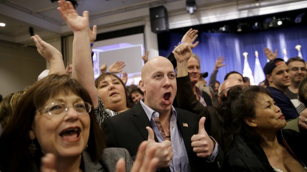 Angry voters align with Trump camp Supporters cheer during a caucus night rally for Donald Trump