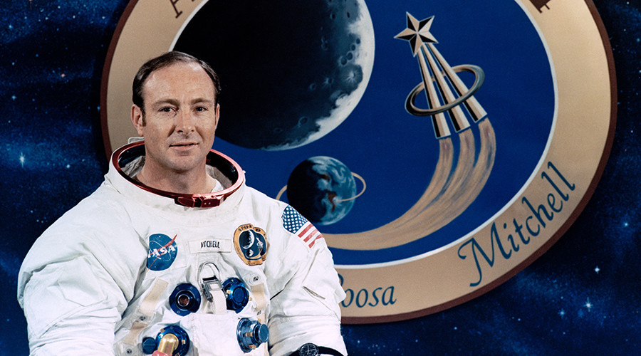 Apollo astronaut Edgar Mitchell posing with the Apollo 14 mission patch in 1971