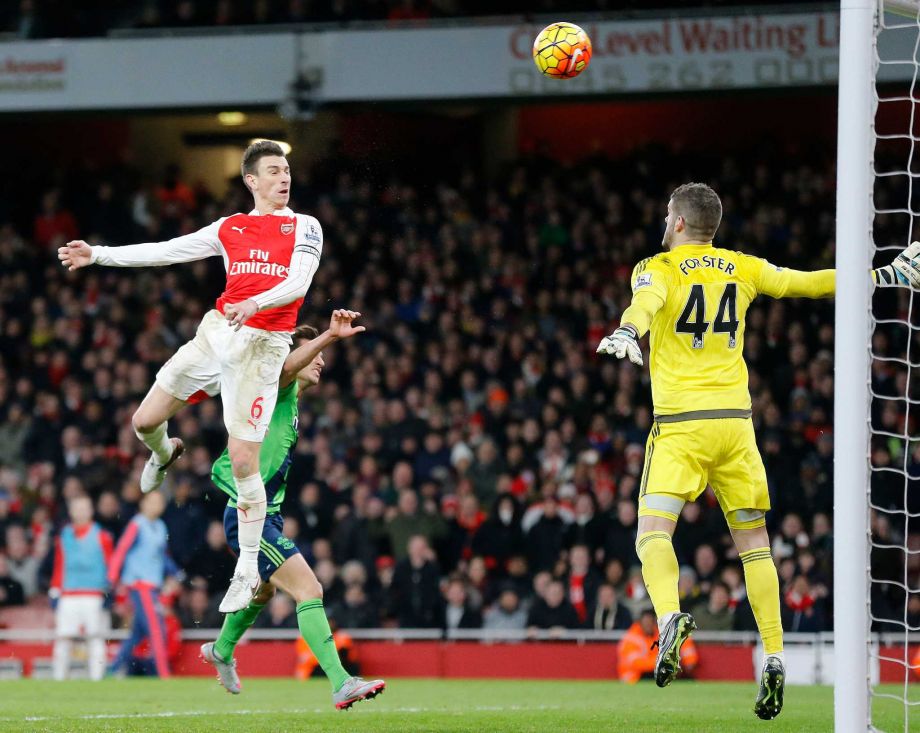 Arsenal's Laurent Koscielny left fails to score against Southampton’s goalkeeper Fraser Forster during the English Premier League soccer match between Arsenal and Southampton at the Emirates stadium in London Tuesday Feb. 2 2016