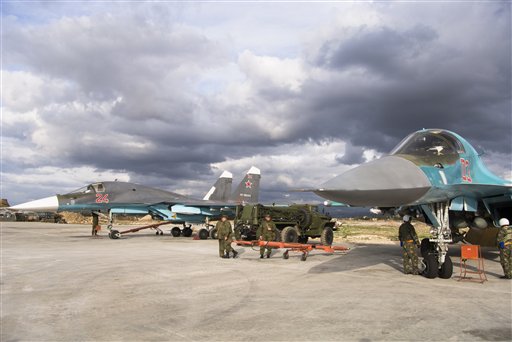 A pair of Russian bombers being readied for action at Hemeimeem air base in Syria on Wednesday Jan. 20 2016. Russian warplanes have flown over 5,700 combat missions since Moscow launched its air campaign in Syria on Sept. 30 2015.(AP