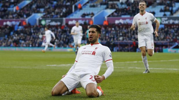 Emre Can celebrates scoring the third goal for Liverpool