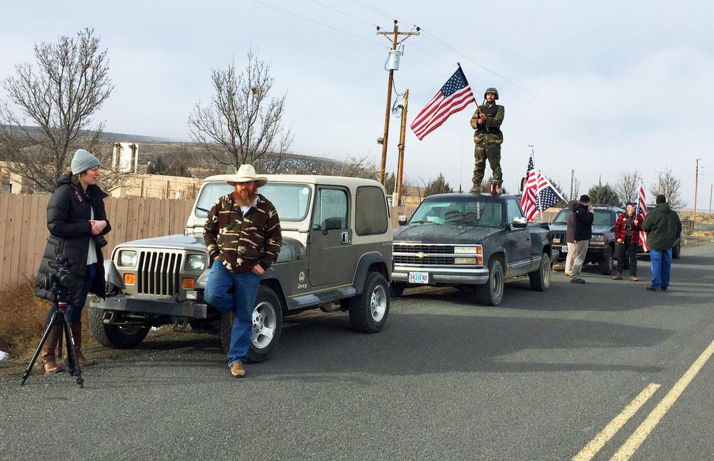 People protesting the FBI action and in support of the armed occupiers of the Malheur National Wildlife Refuge stand outside a roadblock near Burns Ore. on Thursday