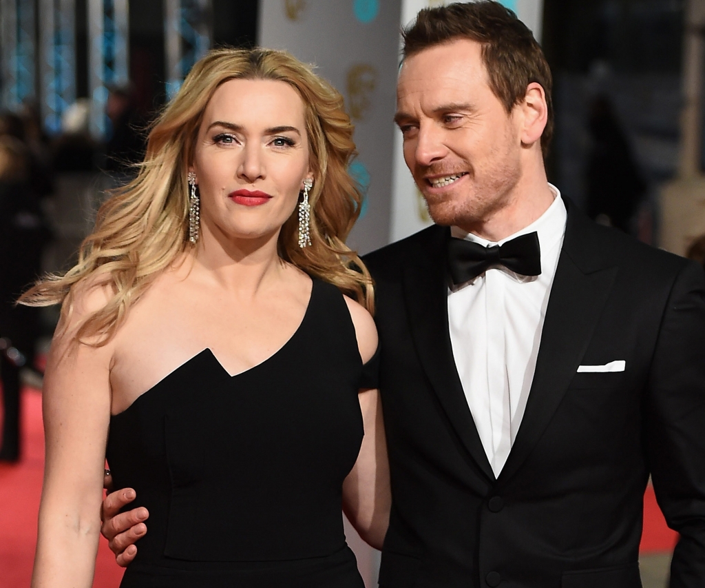 The apple of his eye Michael Fassbender can't stop looking at his *Jobs* co-star Kate Winslet