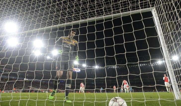 Football Soccer- Arsenal v FC Barcelona- UEFA Champions League Round of 16 First Leg- Emirates Stadium London England- 23/2/16. Arsenal's Petr Cech looks dejected after Lionel Messi scores the second goal for Barcelona from the penalt