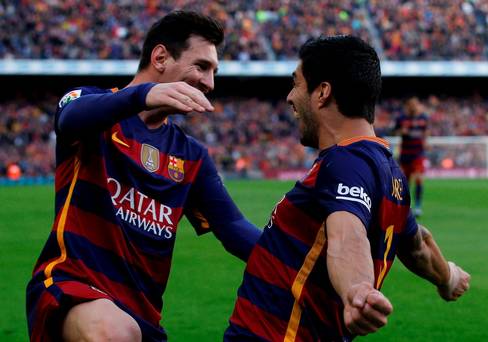 Barcelona's Luis Suarez celebrates with team mate Lionel Messi after scoring a goal. REUTERS  Albert Gea