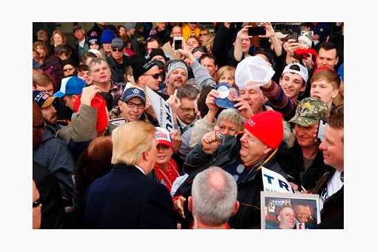 Republican presidential candidate Donald Trump greets the audience at a campaign event at Dubuque Regional Airport Saturday Jan. 30 2016 in Dubuque Iowa