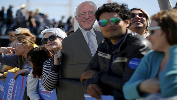 Supporters hold a cardboard cutout of U.S. Democratic presidential candidate and U.S. Senator Bernie Sanders at a campaign rally in Austin Texas