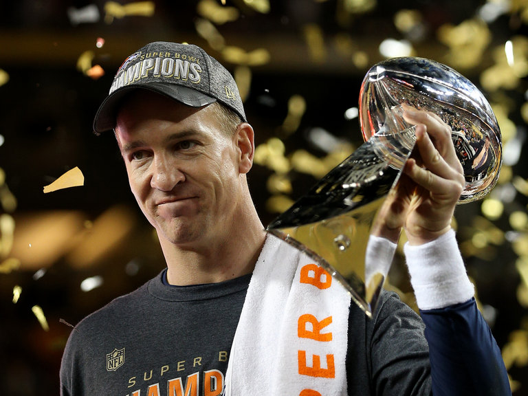 Peyton Manning #18 of the Denver Broncos celebrates with the Vince Lombardi Trophy