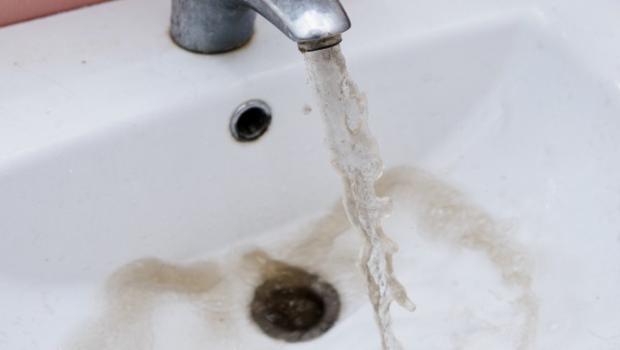 Brown water flows from a faucet in Flint Michigan in this undated