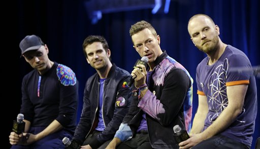 Jonny Buckland left to right Guy Berryman Chris Martin and Will Champion of Coldplay answer questions during a halftime news conference for the upcoming NFL Super Bowl 50 football game Thursday Feb. 4 2016 in San Francisco. (AP