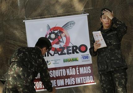 Army soldiers set a banner that reads in Portuguese'A mosquito is not stronger than a whole country at the Central station in Rio de Janeiro Brazil Saturday Feb. 13 2016. More than 200,000 army navy and air force troops are fanning out across Braz